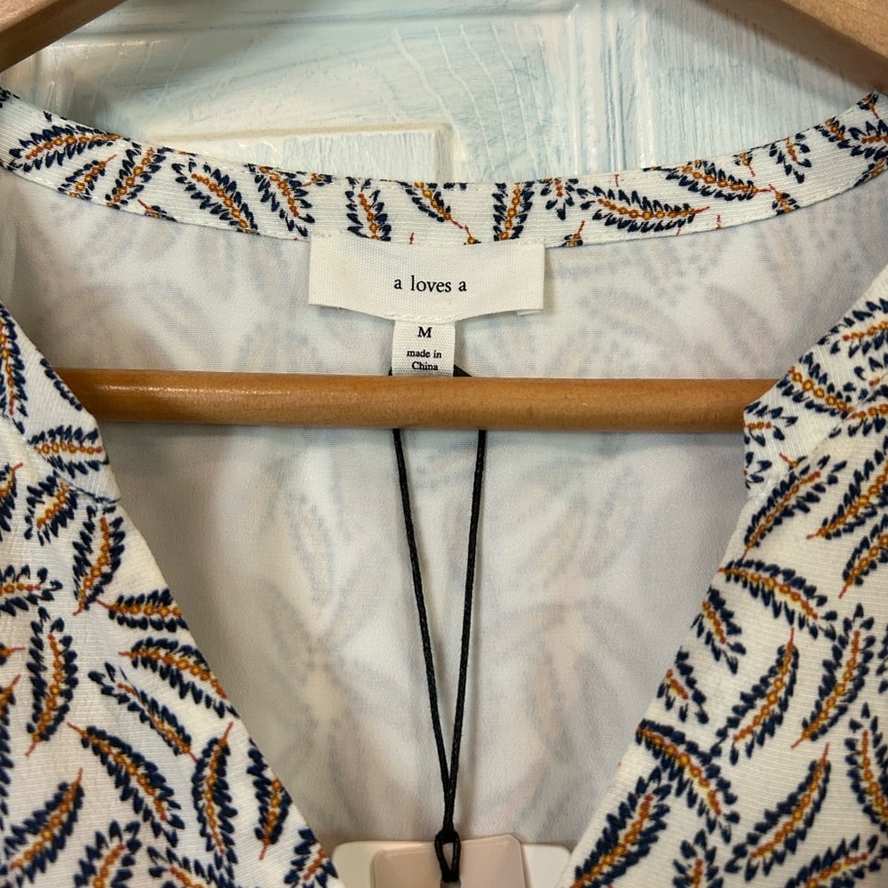 a loves a. Flowy spring/summer dress. New with tags. Size Medium.
